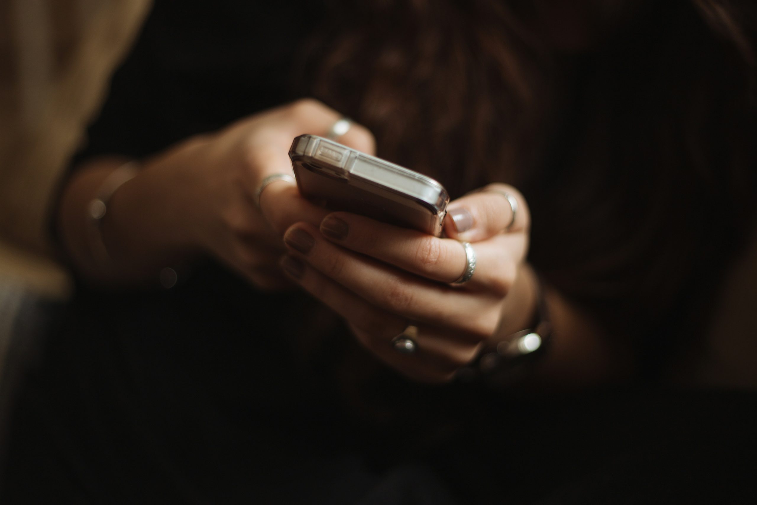 Lady using an iPhone.
